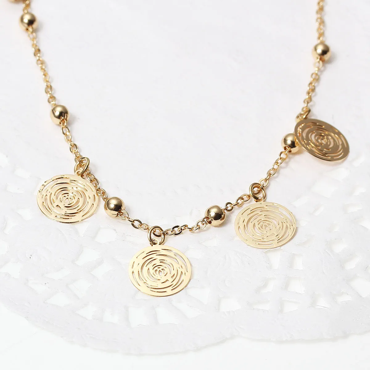 SEXY SPARKLES Filigree Stamping Bell Bracelet  Golden Plated Whit Round Hollow Pendants