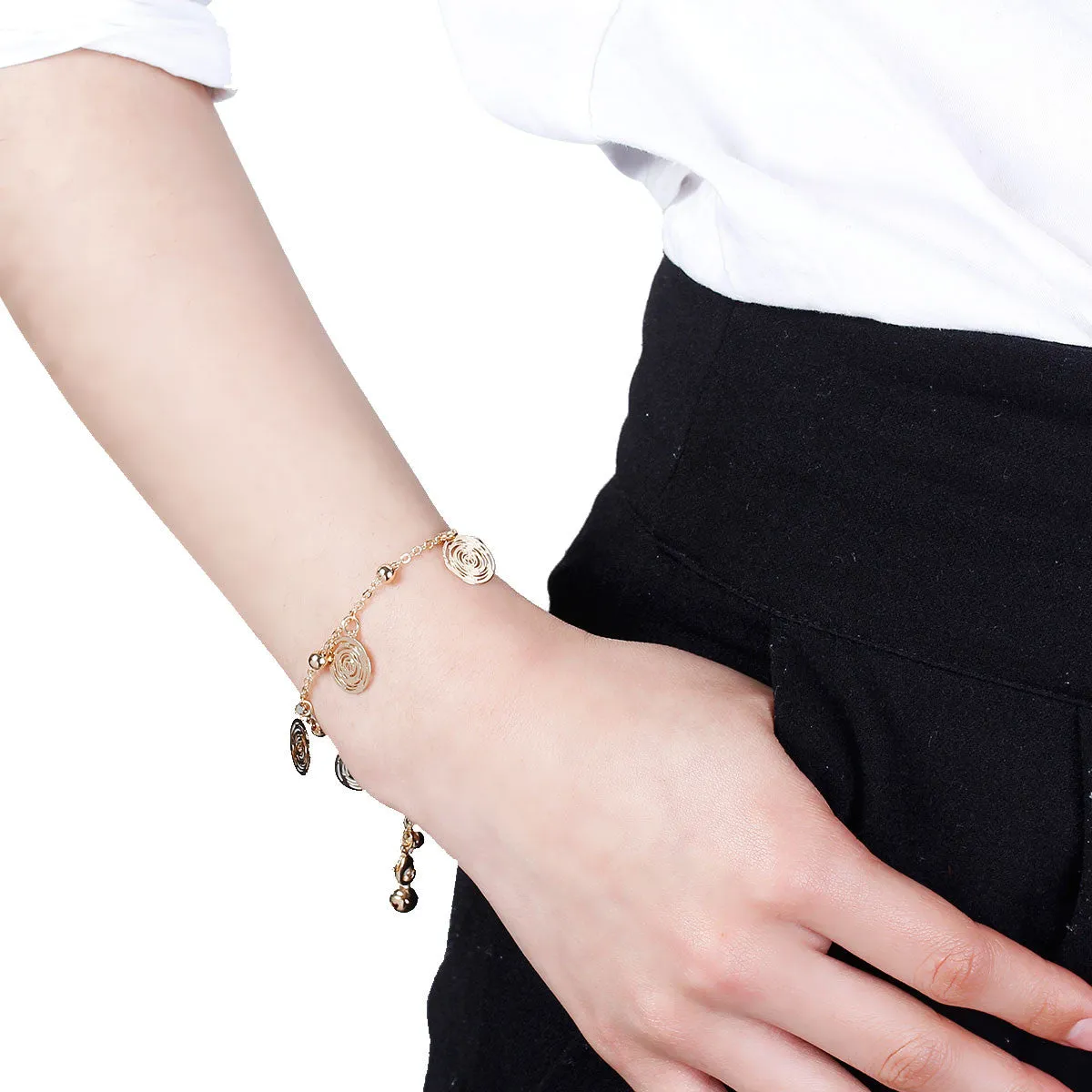SEXY SPARKLES Filigree Stamping Bell Bracelet  Golden Plated Whit Round Hollow Pendants