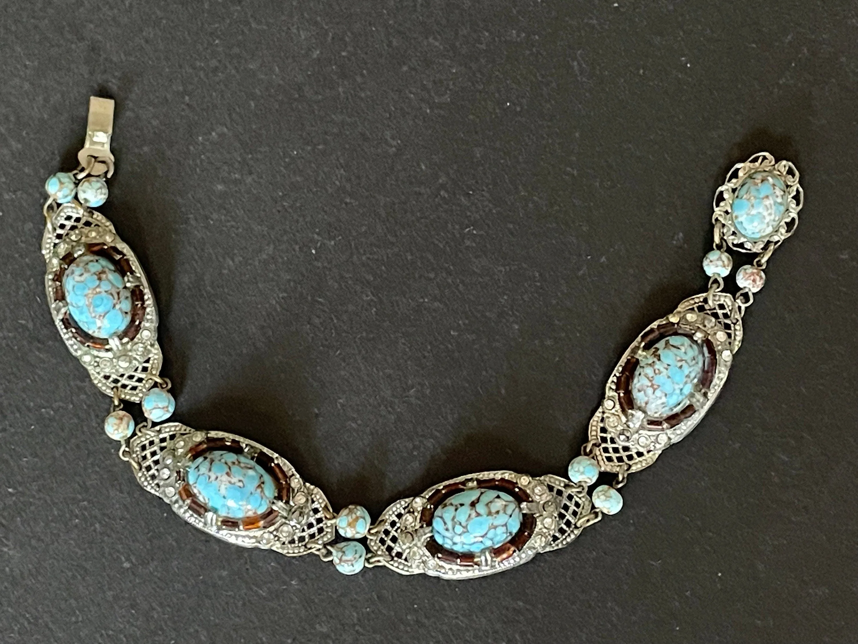 Vintage Art Deco Czech turquoise blue glass cabochon, paste rhinestone and marcasite silver tone filigree panel bracelet, Neiger style